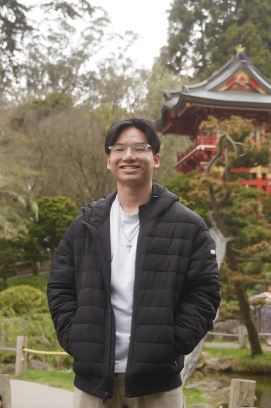 Francis standing in front of a pagoda in a Japanese garden