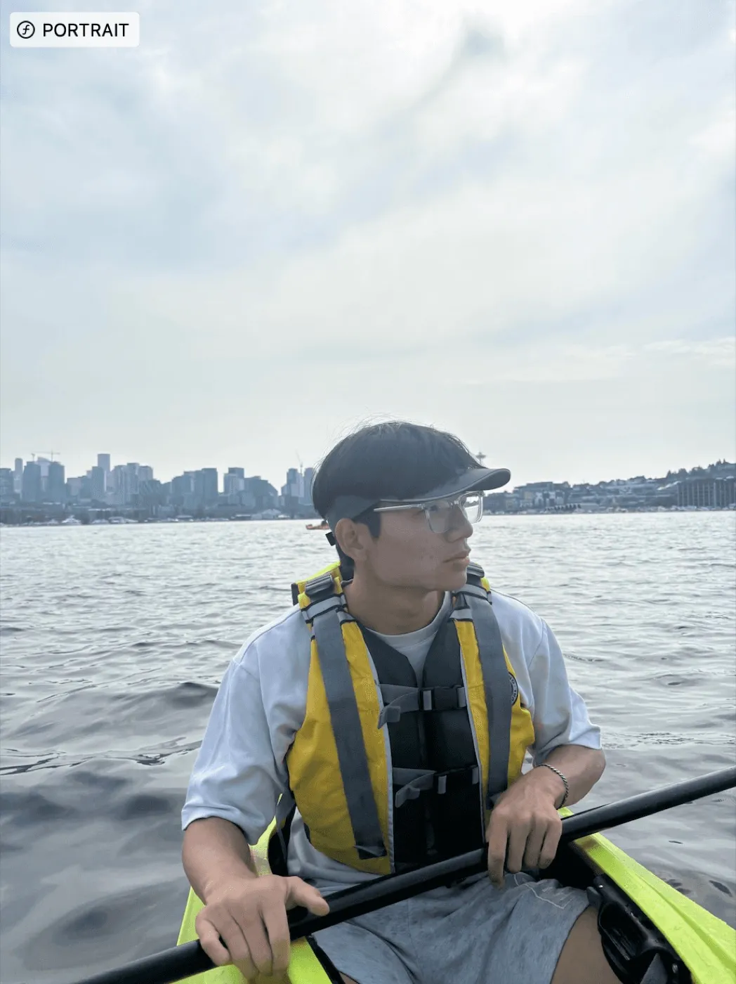 Francis rowing a boat on a lake