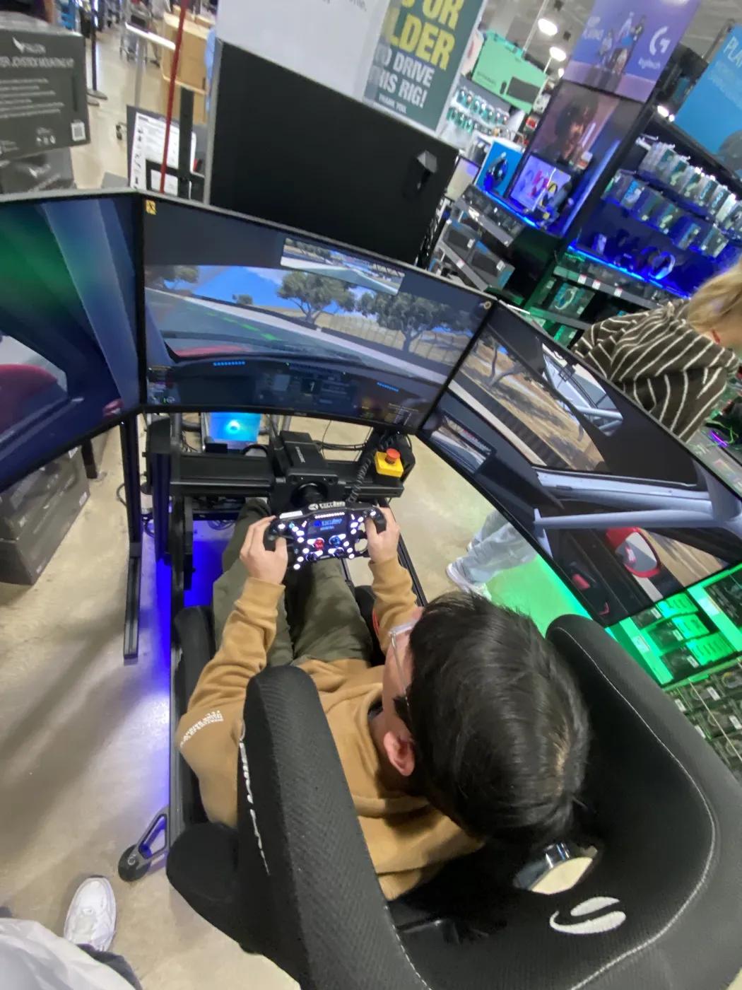 Francis driving a sim racing rig